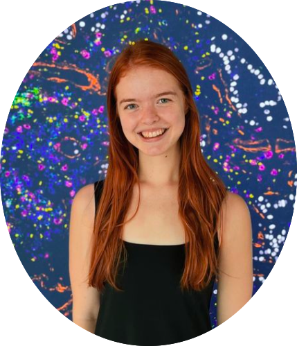 Kaylee in front of a colorful background at MIT